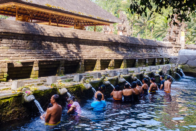 People having bath in sacred water