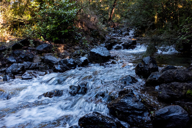 Crossing the stream on the way to falls