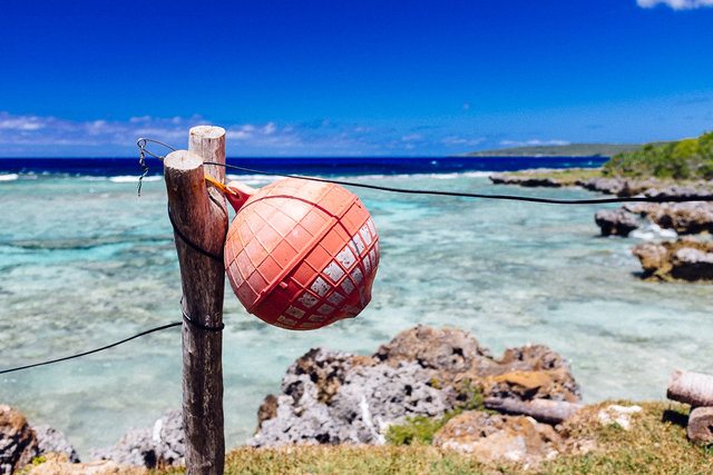 Blue sky and crystal clear water of Lifou