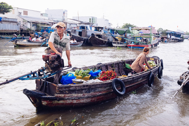 One of smaller boats got closer to try to sell some of their fruit