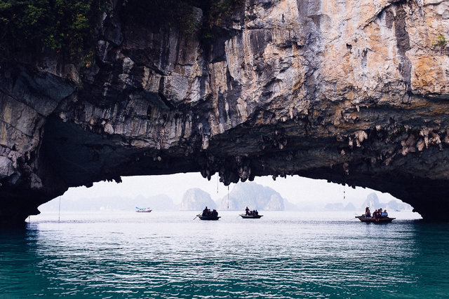 Rowing through the arc near floating Vung Vieng village